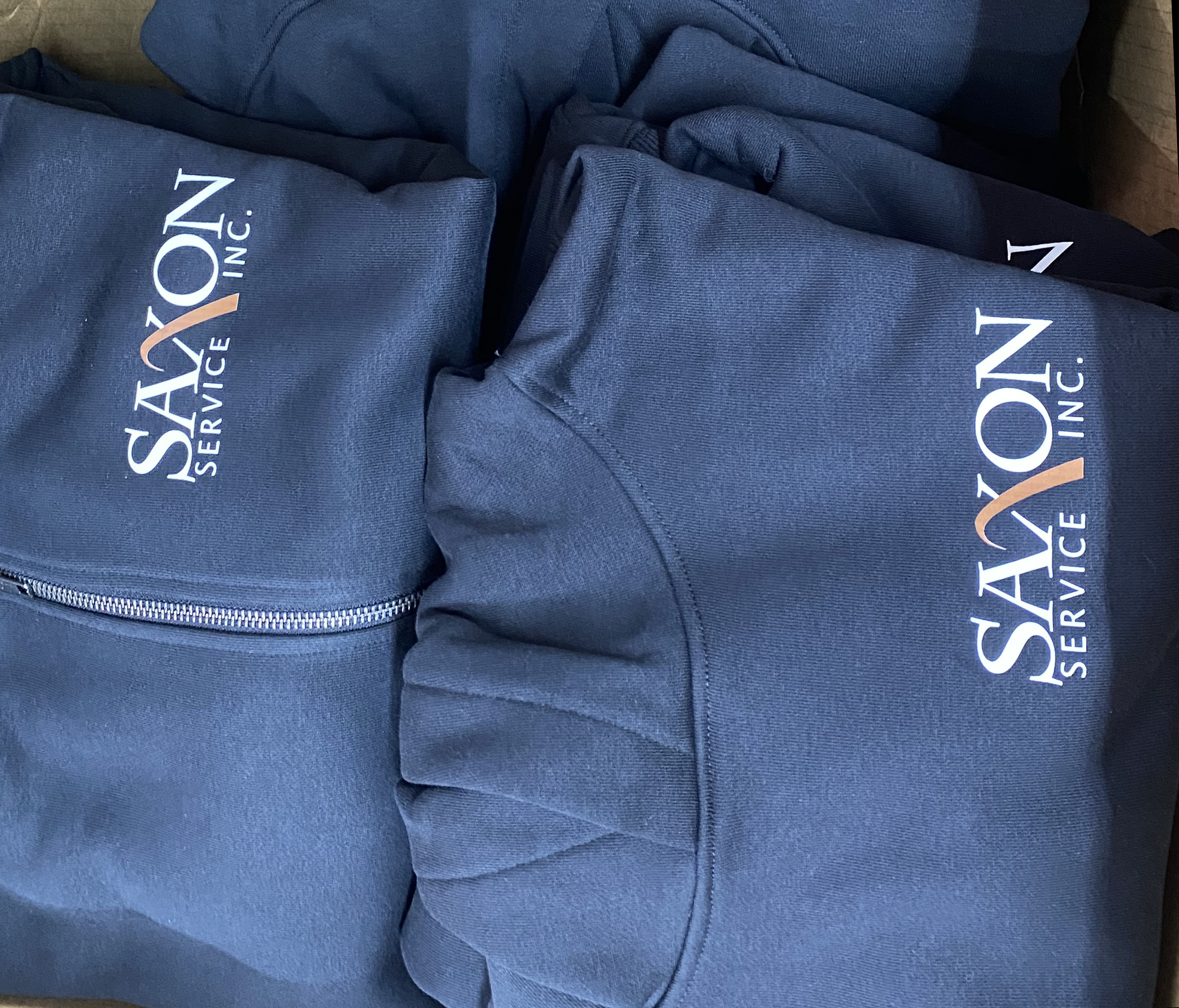 custom-staff-holiday-gifts-hoodies-abbotsford.jpg Custom logo hoodies folded and ready as holiday gifts for a local Fraser Valley business