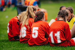 after the soccer game girls in new custom jerseys