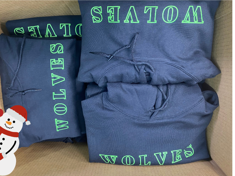Box of finished custom team hoodies packed for delivery at Sport X Canada in Abbotsford, BC.